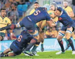  ?? AFP ?? Argentina’s Tomas Lavanini, right, tackles Australia’s Israel Folau.