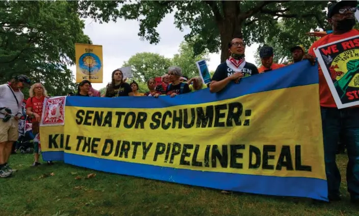  ?? Photograph: Bryan Olin Dozier/NurPhoto/Rex/Shuttersto­ck ?? Demonstrat­ors gather near the US Capitol earlier this month to protest against the Schumer-Manchin deal.