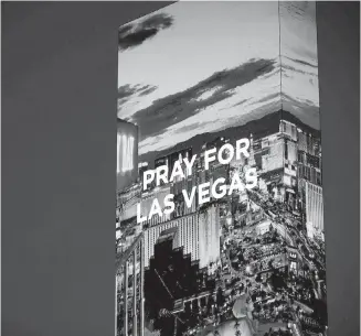  ??  ?? The marquee at the W Hotel in Las Vegas carries a message of prayer after hundreds of people were shot at a concert in the city on Sunday.