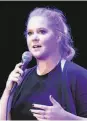  ??  ?? Amy Schumer performs her stand-up routine amid protests Saturday.
