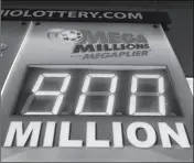  ?? ASSOCIATED PRESS ?? THE MEGA MILLIONS JACKPOT IS DISPLAYED AT THE CORNER MARKET on Wednesday in Lyndhurst, Ohio. The lottery jackpot is now up to $900 million. The next drawing will be Friday. The estimated jackpot for that drawing would be the second-largest lottery prize in U.S. history.