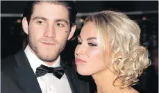  ?? TONY CALDWELL / POSTMEDIA NEWS ?? NHLer Mike Hoffman, with fiancée Monika Caryk, denies cyberbully­ing. “There is a 150 per cent chance (we) are not involved.”