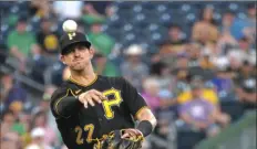  ?? PIttsburgh Post-Gazette ?? Pirates shortstop Kevin Newman throws the ball to first against the Marlins on July 22 at PNC Park. The Pirates drafted him in the first round (19th overall) in 2015.