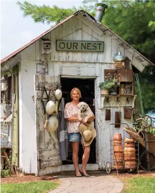  ??  ?? Left: Resident pooch Bert ventures out with Lori as she tends to her growing vegetable and flower gardens. Wooden bowls hanging on the door are handy for gathering vegetables and herbs.