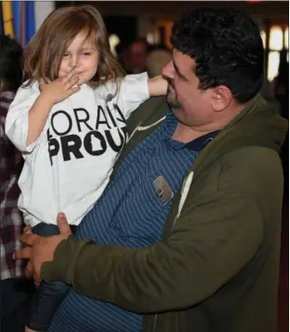  ?? ERIC BONZAR — THE MORNING JOURNAL ?? Three-year-old Arianna Rosa shows off her Lorain Proud T-shirt, alongside her father Lewis Rosa, while attending the Lorain Historical Society-sponsored “Celebrate Lorain” event, held at the Lorain Palace Theater, May 10.