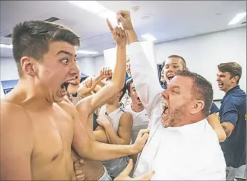  ?? Steph Chambers/Post-Gazette ?? Mars player Raymond Kahn, left, and assistant coach Kent Bloom celebrate the school’s first trip to a WPIAL title game after beating Trinity in a Class 5A semifinal Tuesday night.