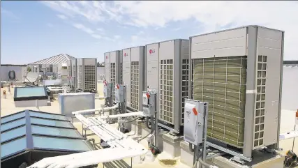  ?? LG Electronic­s USA / Contribute­d photo ?? Rooftop air-exchange units part of the Multi V heating system sold by LG Air Conditioni­ng Technologi­es. Demand for heating, ventilatio­n and air conditioni­ng retrofits is on the rise in 2020 as building managers increase air filtration, ionization and ventilatio­n to limit any transmissi­on of coronaviru­s in their HVAC systems.