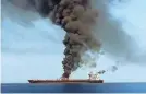  ?? IRANIAN STATE TV VIA AFP/GETTY IMAGES ?? Smoke billows from a tanker that caught fire in the Gulf of Oman.