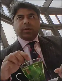  ??  ?? Secretly filmed: Afzal Amin during a meeting with the EDL