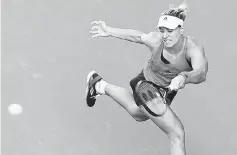  ??  ?? Angelique Kerber returns a shot to Naomi Osaka during the first round match of the Pan Pacific Open tennis tournament in Tokyo. — AFP photo