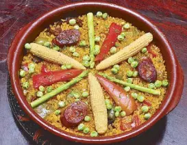  ??  ?? Chef J Gamboa of Circulo Restaurant does a mean Paella
Valenciana with mixed seafood, chorizo, duck and pork. And nobody is crying fowl. (Circulo photo)