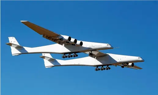  ?? AP ?? Stratolaun­ch, a giant six-engine aircraft with the world’s longest wingspan , makes its first flight from the Mojave Air and Space Port in California.