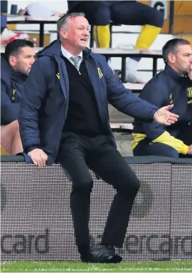  ??  ?? MAKING HIS POINT: Michael O’neill issues instructio­ns at Luton.