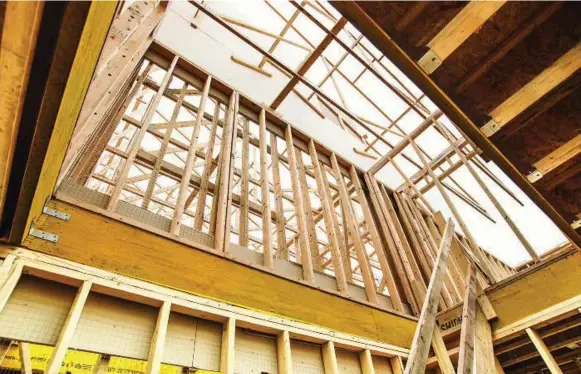  ?? SHAYNE GRAY ?? Thanks to recent amendments to the Ontario Building Code, midrise buildings can now be made with wood frames, a more affordable constructi­on resource.
