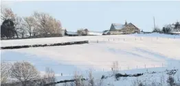  ?? ?? Snow settled on the hills, pasting the valley in cold folds of unbroken white.