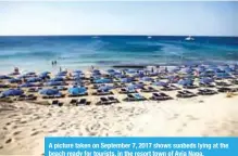  ??  ?? A picture taken on September 7, 2017 shows sunbeds lying at the beach ready for tourists, in the resort town of Ayia Napa.