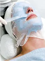  ??  ?? Mask: A client has the treatment – and Mrs Beckham shows the results