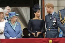 ?? AP PHOTO/MATT DUNHAM, FILE ?? Britain’s Queen Elizabeth II; Meghan, the Duchess of Sussex, and Prince Harry stand on a balcony to watch a flypast of Royal Air Force aircraft pass over Buckingham Palace in London on July 10, 2018.
The timing couldn’t be worse for Harry and Meghan. The Duke and Duchess of Sussex finally had the chance to tell the story behind their departure from royal duties directly to the public on Sunday, when their two-hour interview with Oprah Winfrey was broadcast.