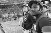  ?? Associated Press ?? Former Reds teammates Joe Morgan, right, and Pete Rose at batting practice in 1980.