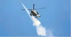  ?? Reuters ?? A Philippine Air Force helicopter fires a rocket during the assault on Maute group in Marawi City yesterday.