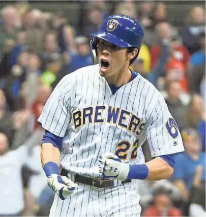 ?? BENNY SIEU / USA TODAY SPORTS ?? Christian Yelich is pumped up after hitting a solo home run in the seventh inning Saturday.