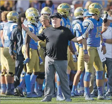  ?? Luis Sinco Los Angeles Times ?? UCLA COACH Chip Kelly, who hasn’t had a winning season at UCLA, now has to deal with everything associated with the COVID-19 pandemic. At least eight Bruins have tested positive, and the season is in jeopardy.