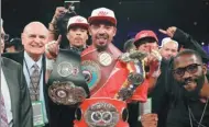  ?? AFP ?? American Andre Ward, adorned with his WBA, IBF and WBO belts, celebrates his victory over Russian Sergey Kovalev.