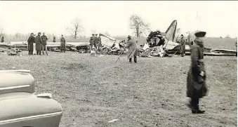  ?? COURTESY OF ELGIN COUNTY ARCHIVES ?? Officials at the scene of an American Airlines DC-3, which crashed Oct. 30, 1941 in a field near Lawrence Station west of St. Thomas. The crash killed all 20 people aboard. Members of Southwold Township council want to install a plaque more than 75...