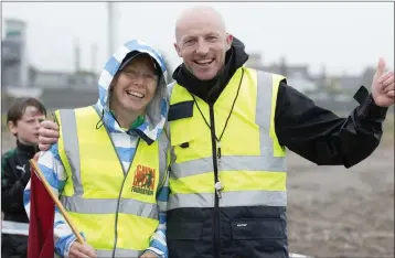  ??  ?? Lisa Howley and Darren McBride, who were monitoring the swimmers getting out of the water.