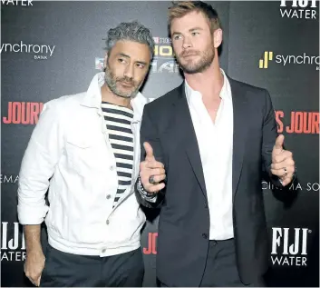  ?? JAMIE MCCARTHY/ GETTY IMAGES ?? Director Taika Waititi and Chris Hemsworth at The Cinema Society’s Screening Of Marvel Studios’ Thor: Ragnarok at the Whitby Hotel on Monday in New York City.