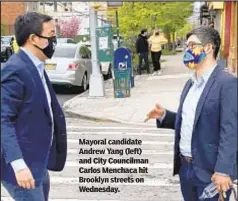  ??  ?? Mayoral candidate Andrew Yang (left) and City Councilman Carlos Menchaca hit Brooklyn streets on Wednesday.