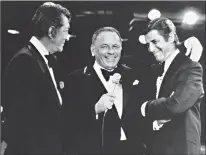  ?? Associated Press ?? Frank Sinatra, center, appearing as a performer Sept. 6, 1976, on the annual Muscular Dystrophy Telethon hosted by Jerry Lewis, right, brings on Dean Martin, Lewis’ old partner, to the surprise of Lewis. It was the first time Martin and Lewis had...