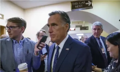  ?? ?? Mitt Romney is surrounded by reporters as he walks to the Senate chamber for votes. Photograph: J Scott Applewhite/AP