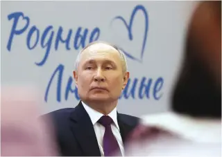  ?? Photo by Sergei KARPUKHIN / POOL / AFP ?? In this pool photograph distribute­d by Russian state-owned agency Sputnik, Russia’s President Vladimir Putin attends a forum for family values in Moscow on January 23, 2024.