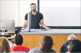  ??  ?? AT LONG BEACH City College, Mushtaq tells his sociology students about being Mr. Long Beach Leather. In May, he’ll seek the title of Internatio­nal Mr. Leather.
