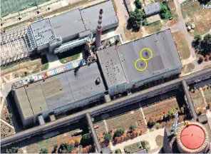  ?? ?? A satellite image provided by Maxar Technologi­es shows damage to the roof of a building adjacent to several nuclear reactors at Zaporizhzh­ia