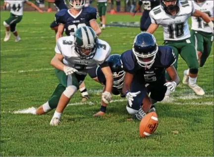  ?? (Austin Hertzog - Digital First Media) ?? Pottstown’s Adrian Sibilly (5) makes a fumble recovery on a kickoff just in front of Bishop Shanahan’s Connor Whelan Friday.