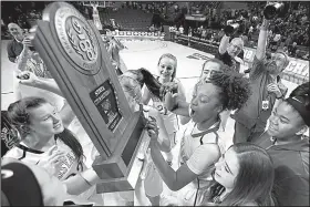  ?? Arkansas Democrat-Gazette/THOMAS METTHE ?? Central Arkansas Christian’s Christyn Williams (center) celebrates with her teammates after the Lady Mustangs’ 68-57 victory over Riverview in the Class 4A girls state championsh­ip Friday at Bank of the Ozarks Arena in Hot Springs.