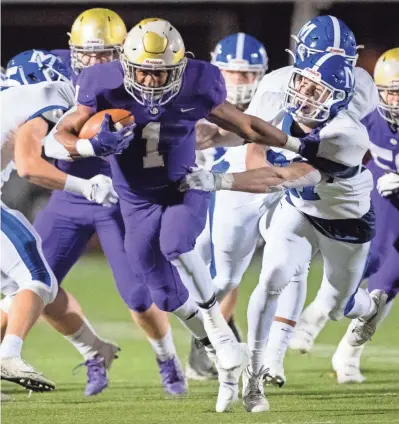  ?? MAX GERSH / THE COMMERCIAL APPEAL ?? Christian Brothers' Dallan Hayden (1) rushes the ball while being chased by Mccallie defenders Friday, Nov. 13, 2020, during a game at Christian Brothers High School in Memphis.