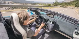 ?? MCLAREN ?? There’s a row of buttons on the console of the 570S Spider for gear selection, and in front of those you’ll find two rotary switches — one for Handling, one for Powertrain.