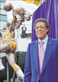  ?? Reed Saxon The Associated Press ?? Lakers offensive great Elgin Baylor at his statue’s 2018 unveiling outside the Staples Center in Los Angeles.