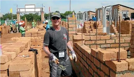  ??  ?? Dean Eager in Cambodia in 2013 during the Habitat for Humanity project to build homes for impoverish­ed villagers.