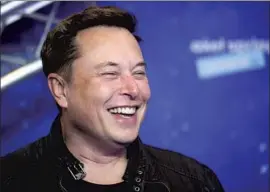  ?? Hannibal Hanschke Associated Press ?? THE NET worth of Tesla and SpaceX chief Elon Musk was $ 194.5 billion at Thursday’s market close, $ 9.5 billion more than that of Amazon. com’s founder.