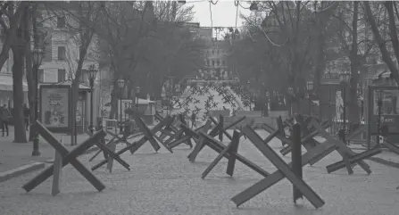  ?? PETROS GIANNAKOUR­IS/AP ?? Anti-tank barricades are placed on a street in preparatio­n for a possible Russian offensive in Odesa, Ukraine.