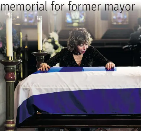  ?? NATHAN DENETTE/THE CANADIAN PRESS ?? Former Toronto mayor Rob Ford’s widow Renata weeps at her husband’s casket at St. James Cathedral in Toronto on Wednesday.