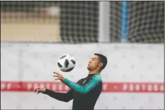  ?? The Associated Press ?? CR7: Portugal’s Cristiano Ronaldo controls a ball during the Portuguese national team’s training session Wednesday in Kratovo in the outskirts of Moscow, Russia, ahead of Friday’s FIFA 2018 World Cup match against rival Spain, which replaced its manager on Wednesday.