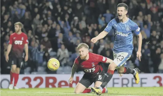  ??  ?? 2 Jason Holt celebrates as his shot heads for the Kilmarnock net to give Rangers the lead at Ibrox last night. Below, Chris Burke scores the visitors’ late equaliser.