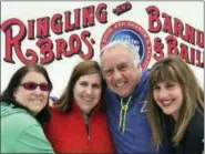  ?? TAMARA LUSH — ASSOCIATED PRESS ?? Gene Goldstein, center right, and his family stop for a photo Saturday outside the Nassau Veteran’s Memorial Coliseum in Uniondale, N.Y., which is hosting the final performanc­es of the Ringling Brothers and Barnum & Bailey Circus. From left are Cheryl...