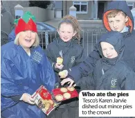  ??  ?? Who ate the pies Tesco’s Karen Jarvie dished out mince pies to the crowd