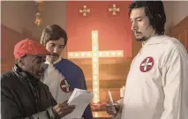  ?? DAVID LEE Focus Features via AP ?? Director Spike Lee, left, with actors Topher Grace, center, and Adam Driver on the set of Lee's film ‘BlacKkKlan­sman.’